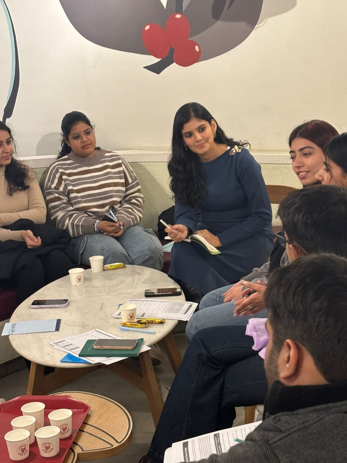 Ankita leading a group conversation